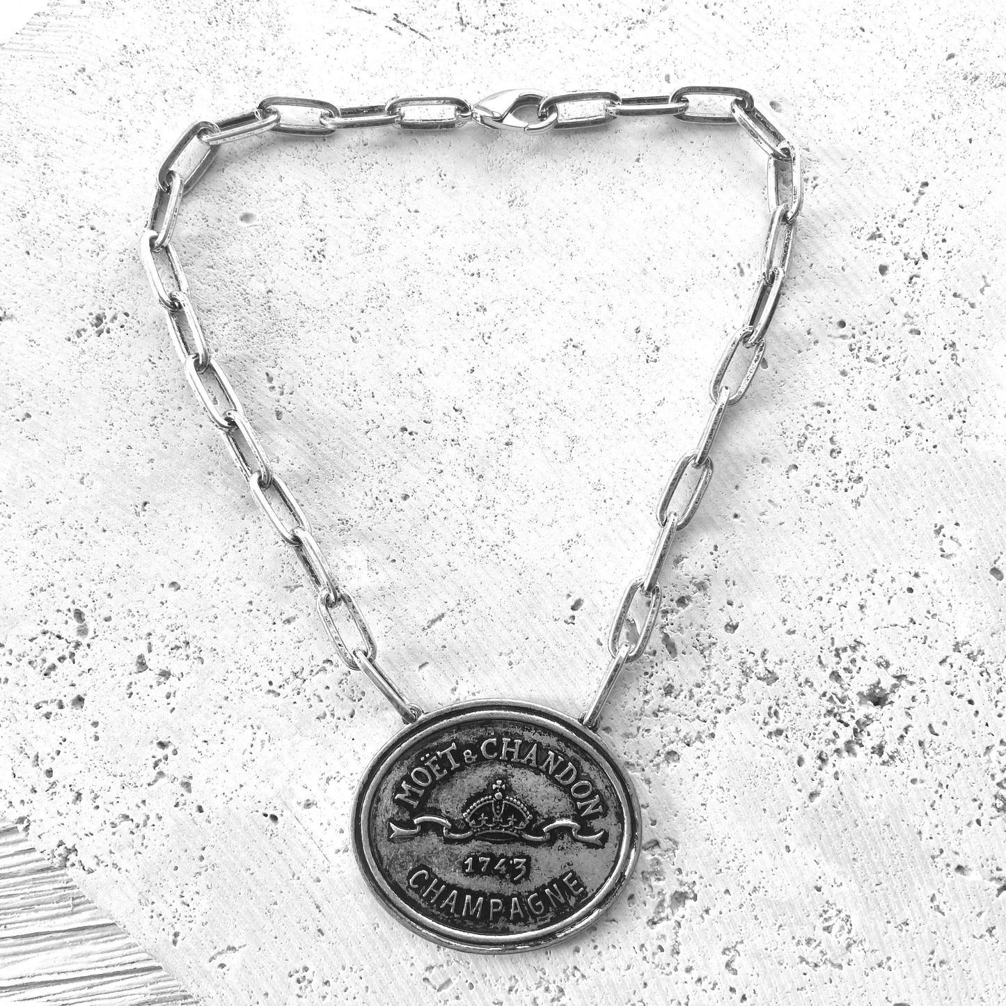 French champagne, coin, necklace, statement